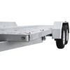 Close-up view of the Premium Hydraulic Tipper Car Trailer 4200kg ATM 16.4x6.6FT (5x2M) Deck Size with a punched floor, featuring dual wheels and wheel fenders, photographed from a low angle against a white background.