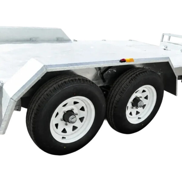 Close-up of the Premium Dual Axle Car Trailer’s dual axle, featuring two black tires with white rims, showcased on a white background.