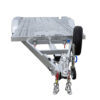 A Premium Dual Axle Car Trailer in silver, featuring a 16.4×6.6 ft (5x2 m) punched metal deck, a front-mounted spare tire, hitch mechanism with safety chains, and a perforated loading surface—4200kg ATM (Pre-order).