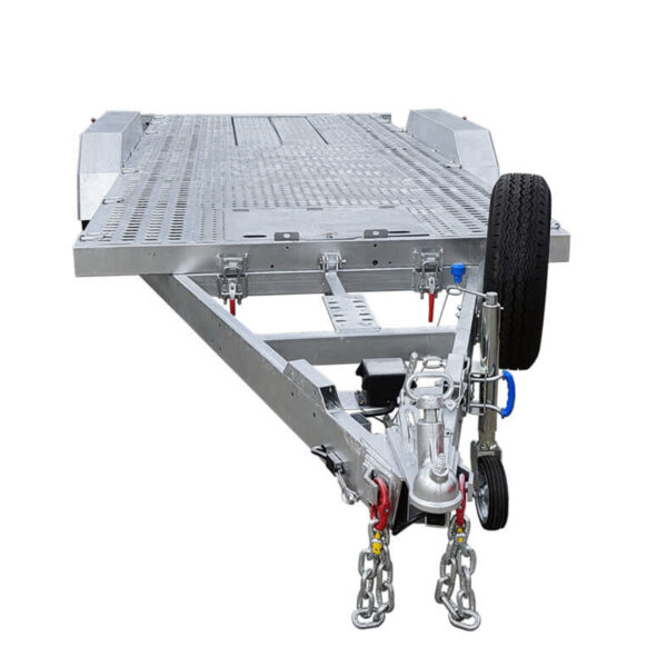 A Premium Dual Axle Car Trailer in silver, featuring a 16.4×6.6 ft (5x2 m) punched metal deck, a front-mounted spare tire, hitch mechanism with safety chains, and a perforated loading surface—4200kg ATM (Pre-order).