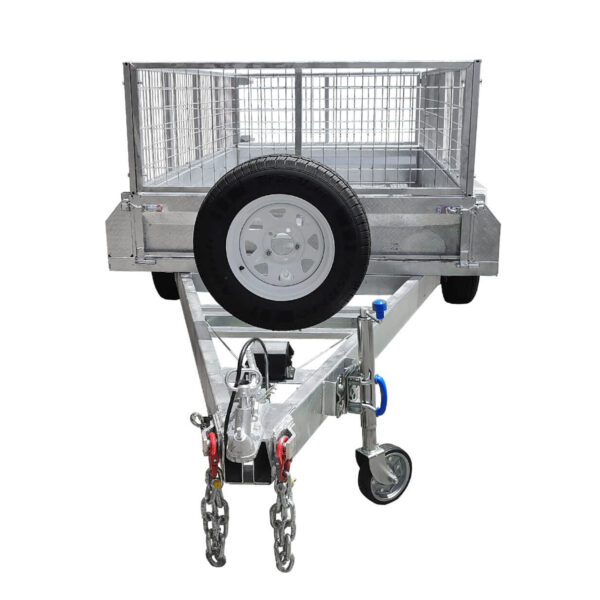 The 8×5 Dual Axle Hydraulic Tipper Tandem Box Trailer 3200kg ATM (Pre-order) features a robust metal construction with a mesh cage, front wheel, and a spare tire mounted at the front. Chains hang from the hitch, and it is designed for efficient towing.