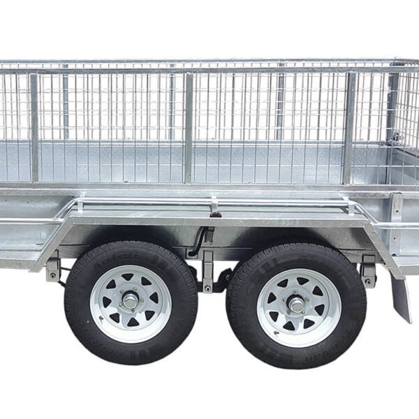 A close-up side view of the 8×5 Dual Axle Hydraulic Tipper Tandem Box Trailer 3200kg ATM (Pre-order) featuring two wheels with white rims and a wire mesh cage on top.
